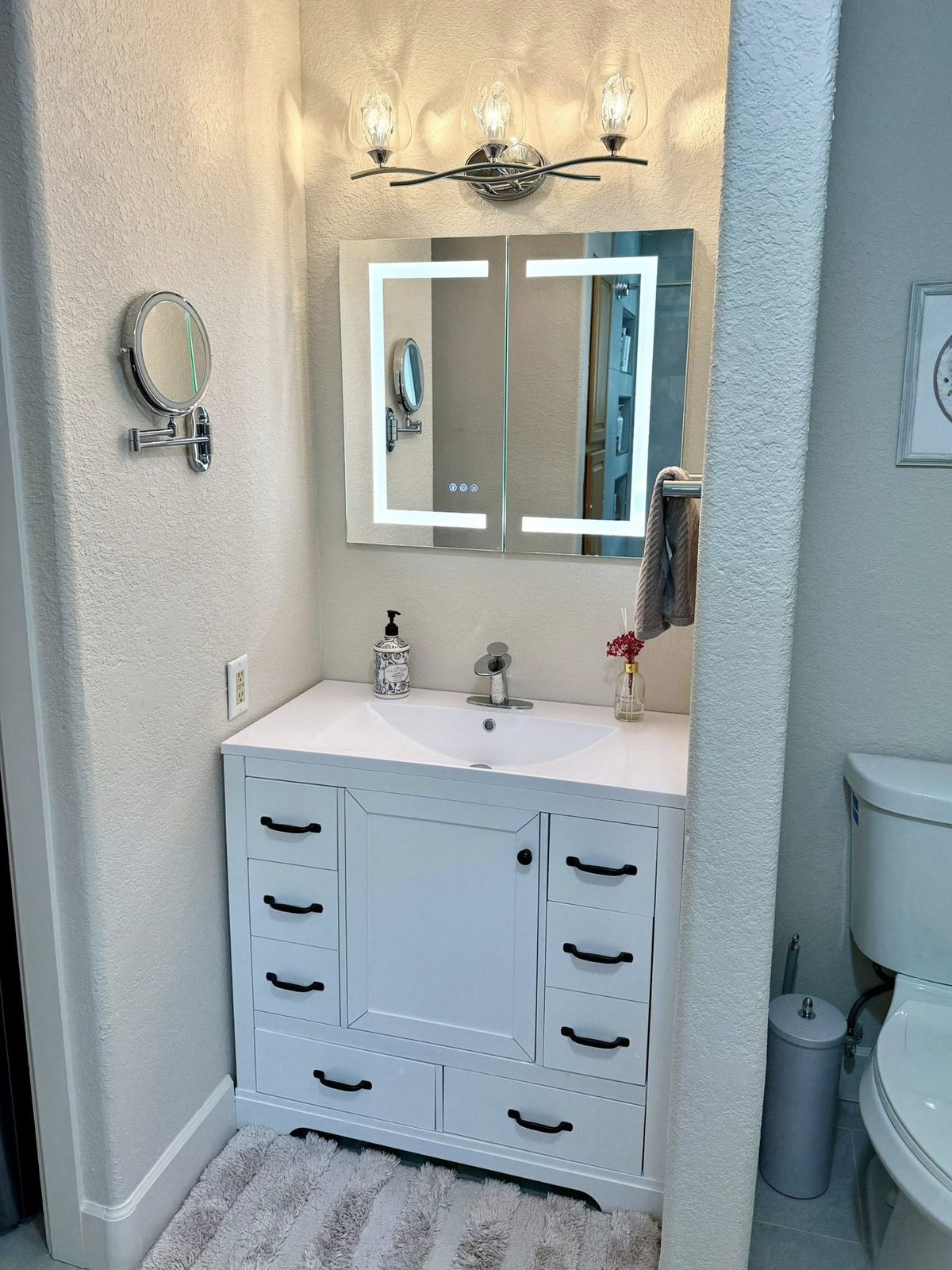 Bathroom vanity with a backlit LED mirror