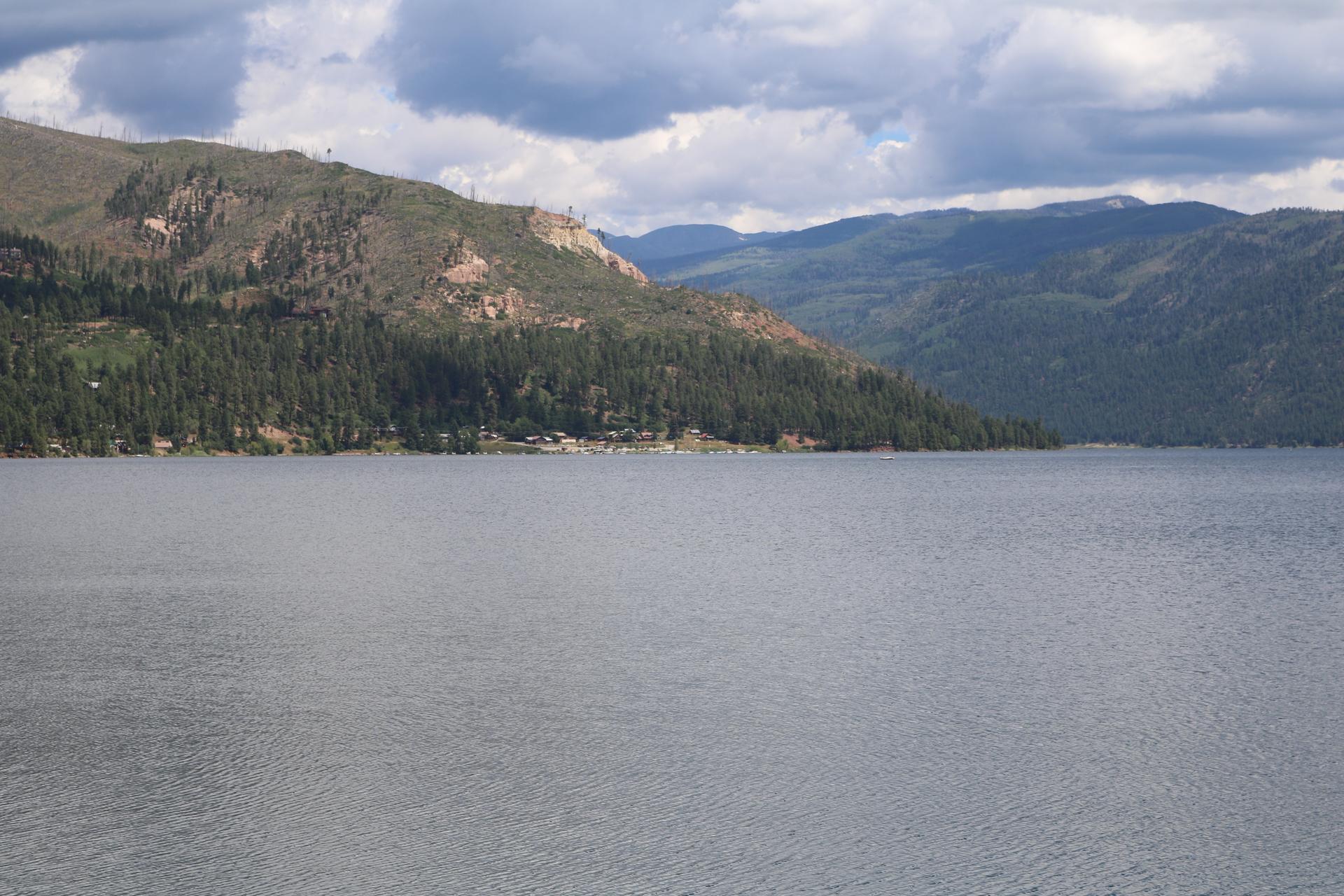 A view across Vallecito Reservoir to the marina shore and forested hills